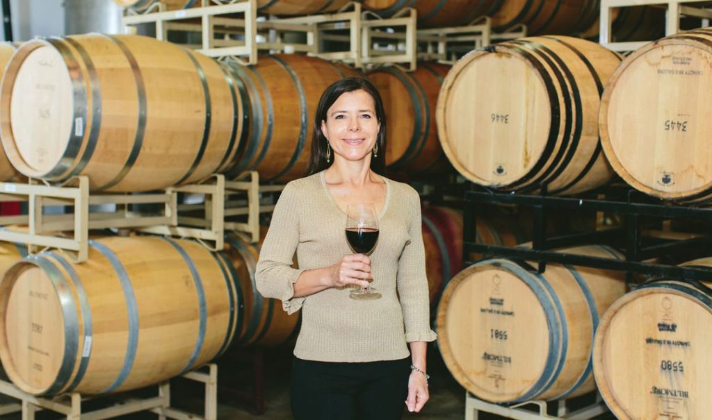 Biltmore winemaker Sharon Fenchak with wine barrels
